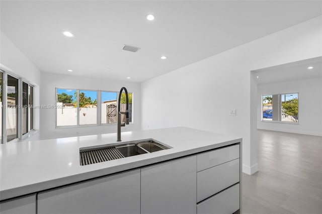 kitchen with sink and white cabinets