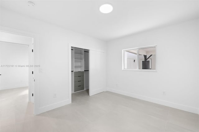 unfurnished bedroom featuring a closet and light tile patterned flooring