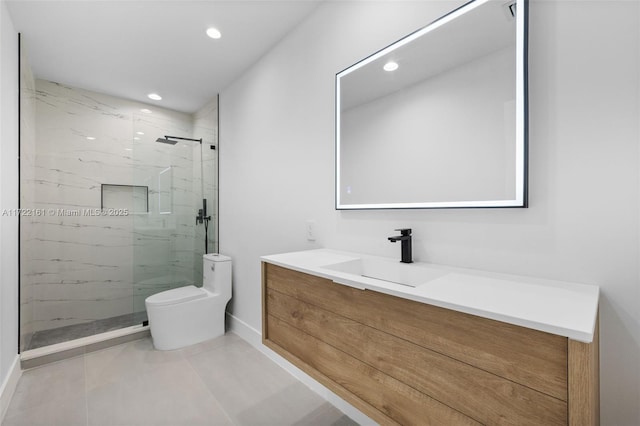 bathroom with a tile shower, tile patterned floors, vanity, and toilet