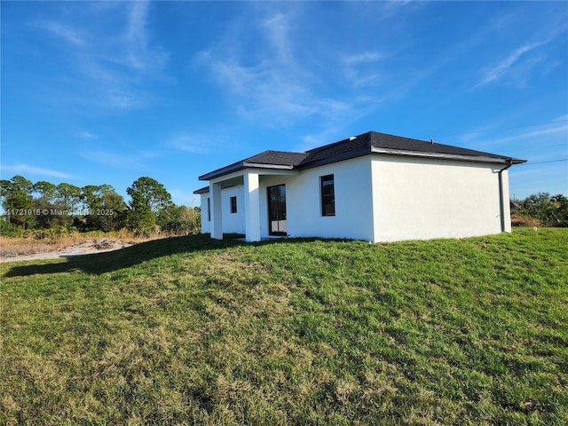 back of house with a yard