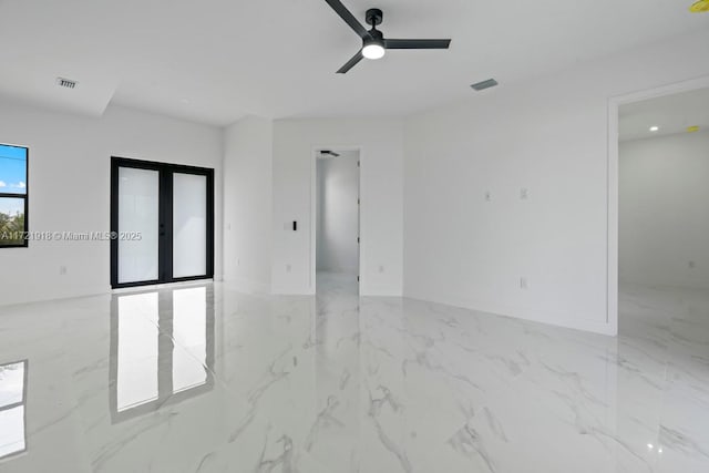 1608 Flora Ave S, Lehigh Acres, FL 33976 - empty room featuring a ceiling fan, marble finish floor, visible vents, and french doors