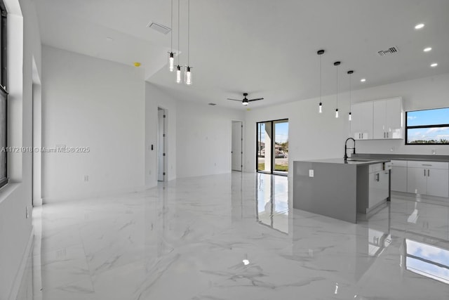 1608 Flora Ave S, Lehigh Acres, FL 33976 - kitchen with marble finish floor, visible vents, open floor plan, and modern cabinets