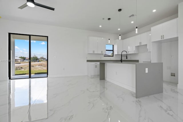 1608 Flora Ave S, Lehigh Acres, FL 33976 - kitchen featuring recessed lighting, visible vents, white cabinetry, marble finish floor, and a center island