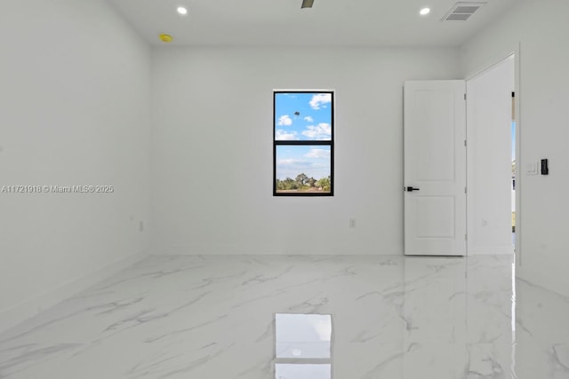 1608 Flora Ave S, Lehigh Acres, FL 33976 - empty room with marble finish floor, visible vents, and recessed lighting