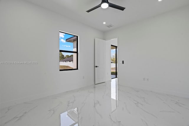 1608 Flora Ave S, Lehigh Acres, FL 33976 - spare room with marble finish floor, a ceiling fan, visible vents, and recessed lighting