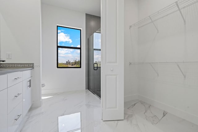 1608 Flora Ave S, Lehigh Acres, FL 33976 - full bath with a stall shower, marble finish floor, a spacious closet, and baseboards