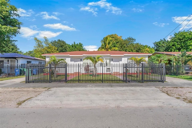 ranch-style house with a garage and a front lawn