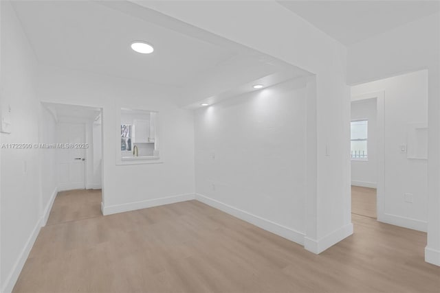 spare room with light hardwood / wood-style floors