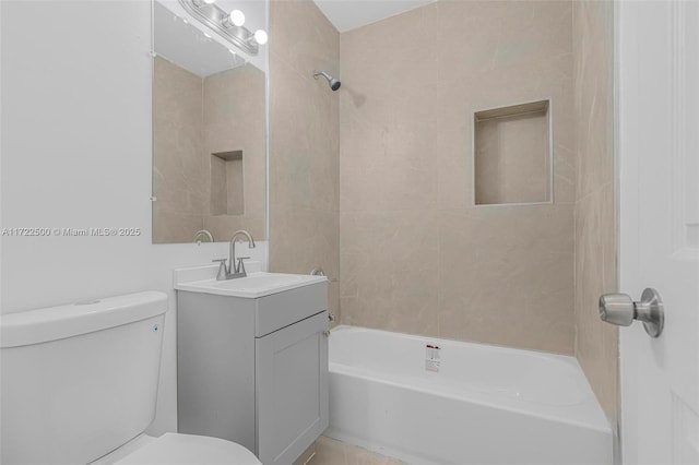 full bathroom featuring vanity, toilet, and tiled shower / bath combo