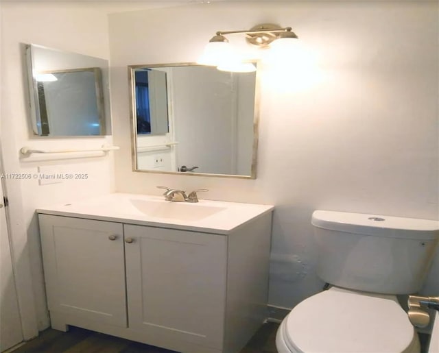 bathroom with vanity and toilet