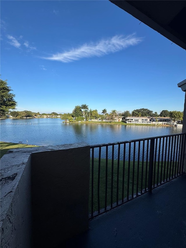 balcony featuring a water view