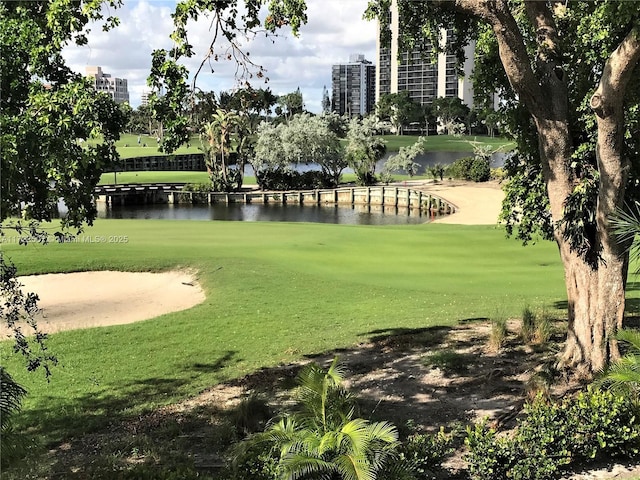 20246 NE 34th Ct Unit 46, Aventura, FL 33180 - surrounding community with a lawn, a water view, and view of golf course
