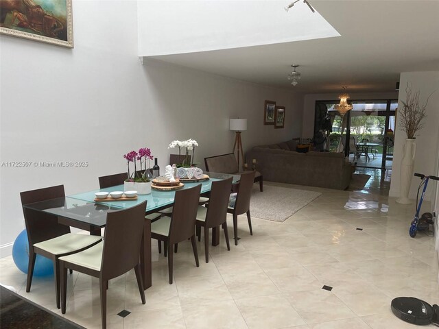 dining area featuring an inviting chandelier