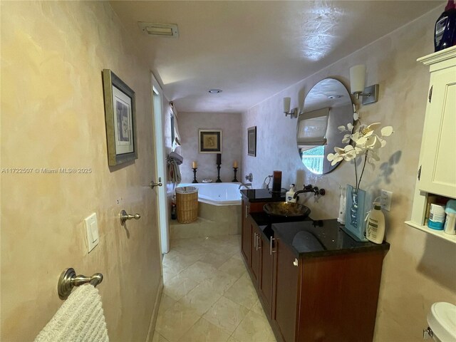 bathroom featuring a tub and vanity