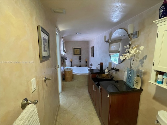20246 NE 34th Ct Unit 46, Aventura, FL 33180 - bathroom featuring a bath, vanity, and toilet