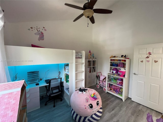 bedroom featuring ceiling fan, dark hardwood / wood-style flooring, and lofted ceiling