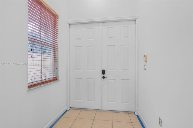 doorway to outside featuring light tile patterned floors