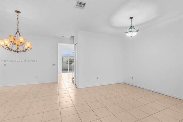 unfurnished room featuring light tile patterned floors and a chandelier