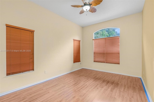 spare room with ceiling fan and light hardwood / wood-style floors