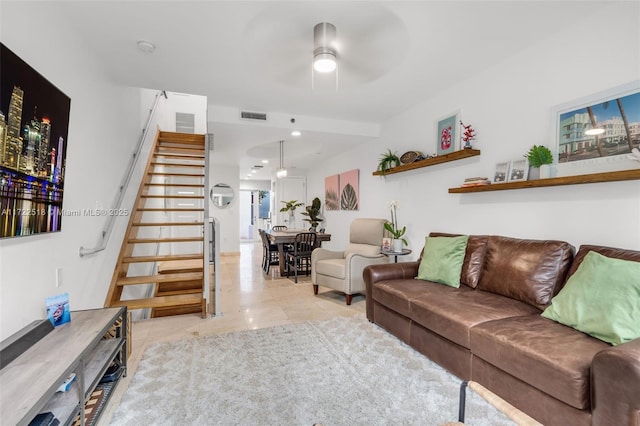 tiled living room featuring ceiling fan