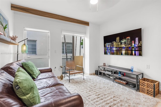 living room with beam ceiling