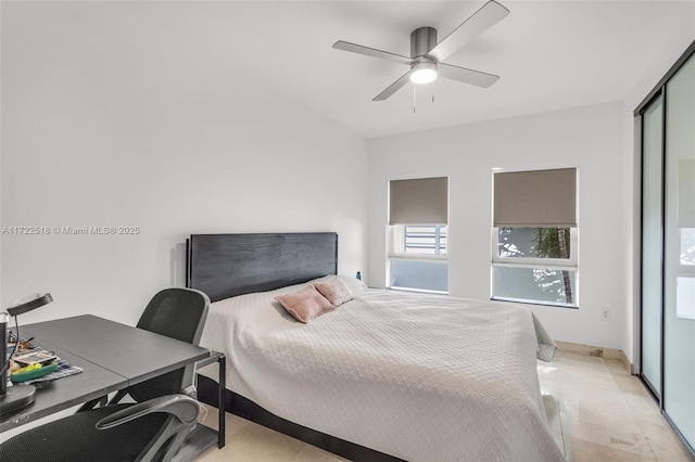 bedroom featuring a closet, ceiling fan, and light tile patterned flooring