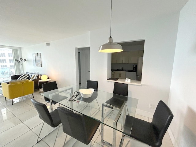 dining area featuring light tile patterned floors