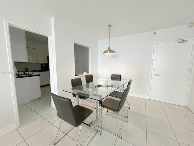 dining area with light tile patterned flooring