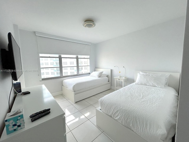 bedroom featuring light tile patterned flooring