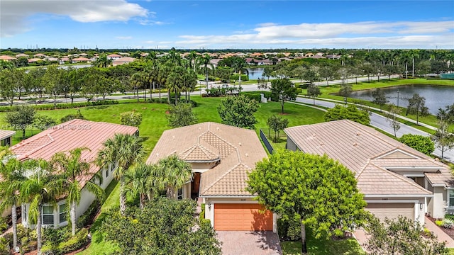 birds eye view of property with a water view