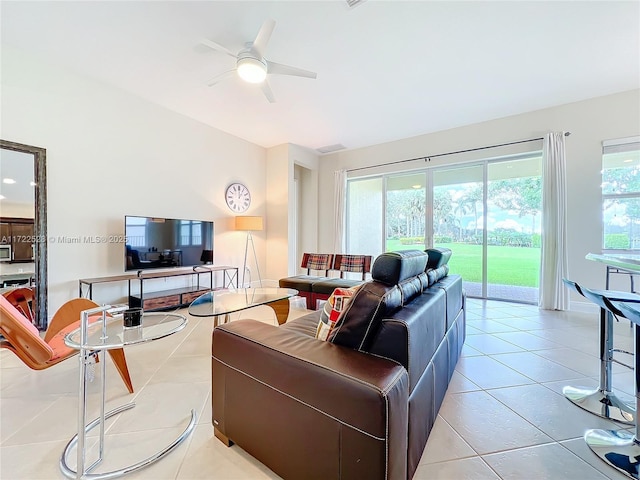 living room featuring ceiling fan and light tile patterned floors