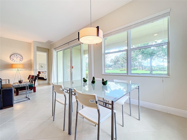 dining area featuring light tile patterned floors