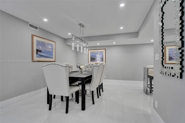 dining area featuring light tile patterned flooring