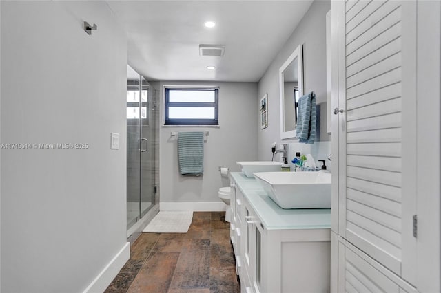 bathroom with walk in shower, vanity, decorative backsplash, and toilet