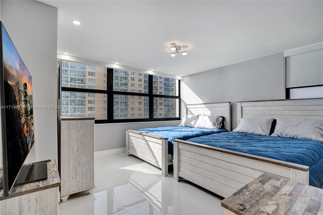 bedroom with light tile patterned floors