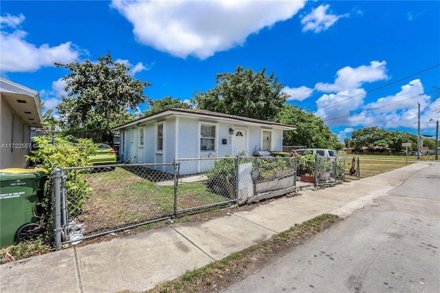 651 SW 5th St, Homestead, FL 33030 - bungalow with a fenced front yard and a gate