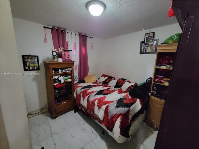 651 SW 5th St, Homestead, FL 33030 - bedroom with a textured ceiling