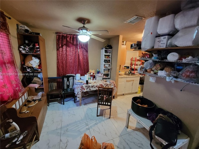 651 SW 5th St, Homestead, FL 33030 - bedroom featuring marble look tiles and a textured ceiling