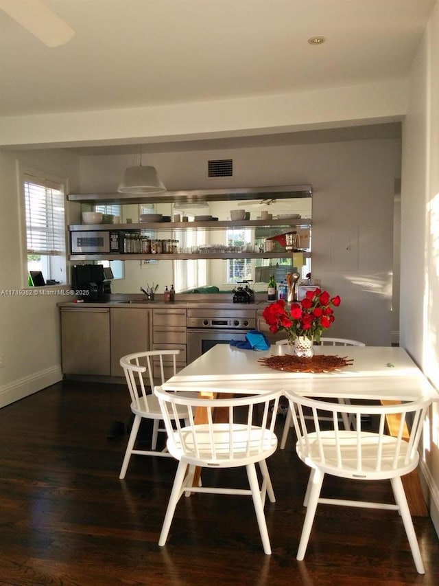 dining room featuring dark hardwood / wood-style flooring