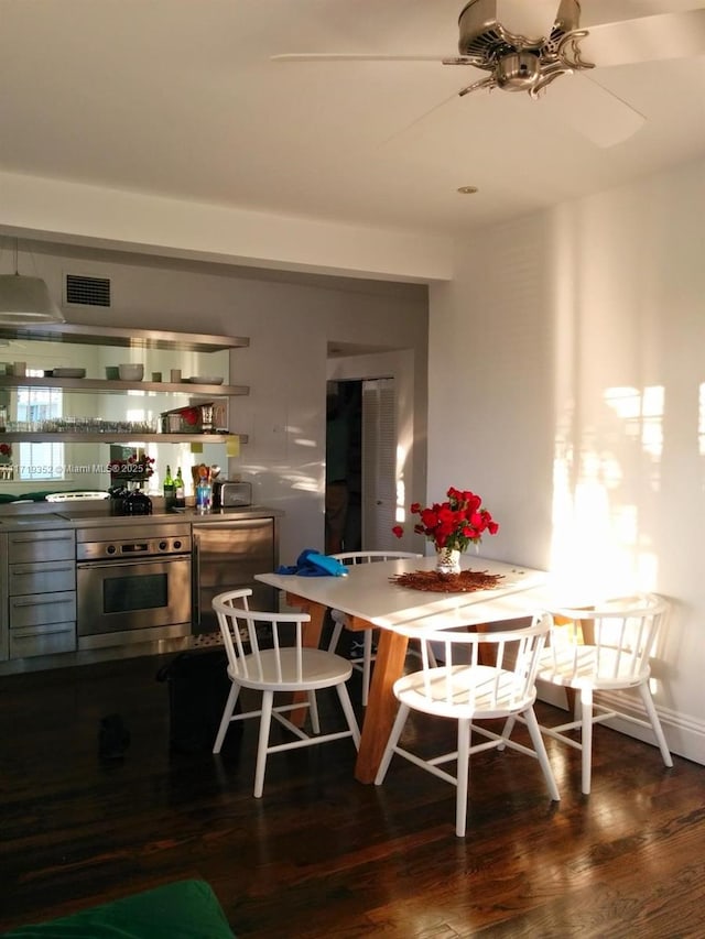 dining area featuring dark hardwood / wood-style flooring