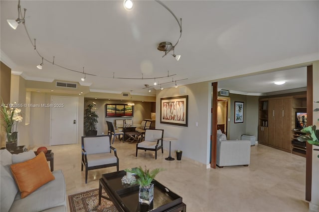 living room featuring crown molding