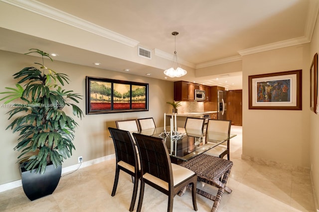 dining area with crown molding and light tile patterned floors