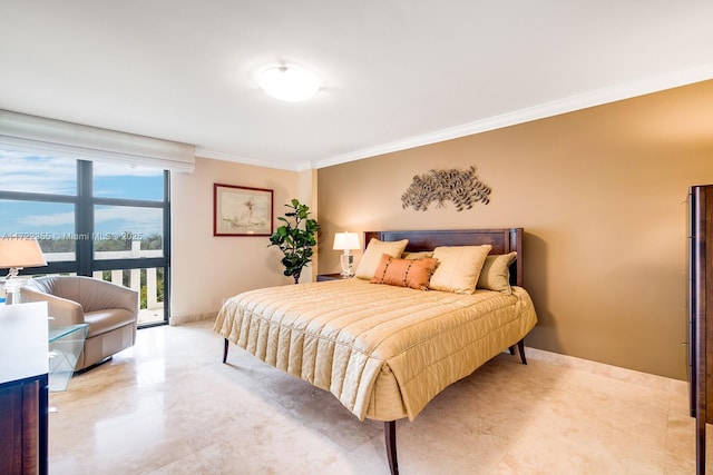 bedroom with access to exterior and crown molding