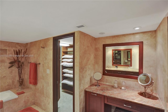 bathroom with vanity and walk in shower