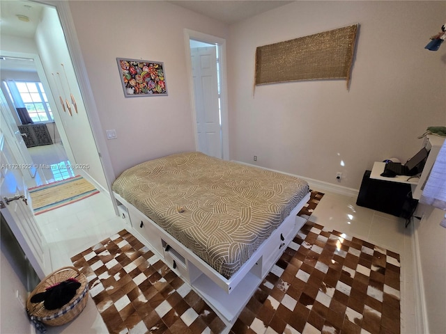 bedroom featuring dark tile patterned floors