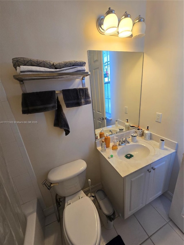 bathroom featuring tile patterned floors, vanity, and toilet