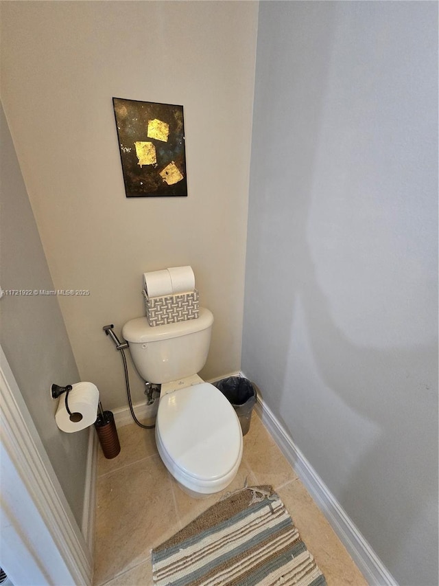 bathroom with tile patterned floors and toilet