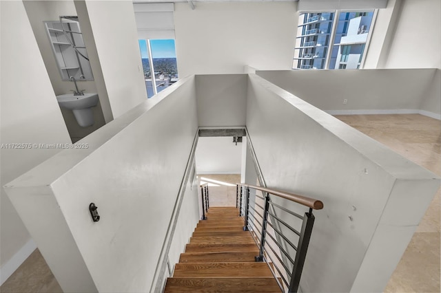 staircase featuring wood-type flooring