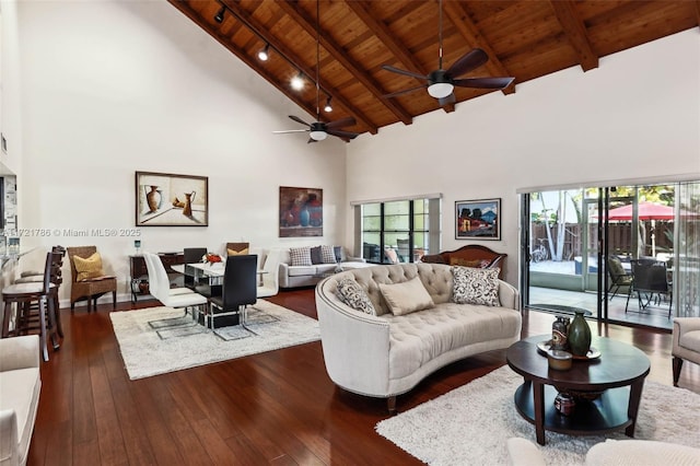 living room featuring ceiling fan, beam ceiling, wooden ceiling, and high vaulted ceiling