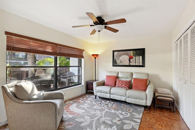 living room with parquet flooring and ceiling fan